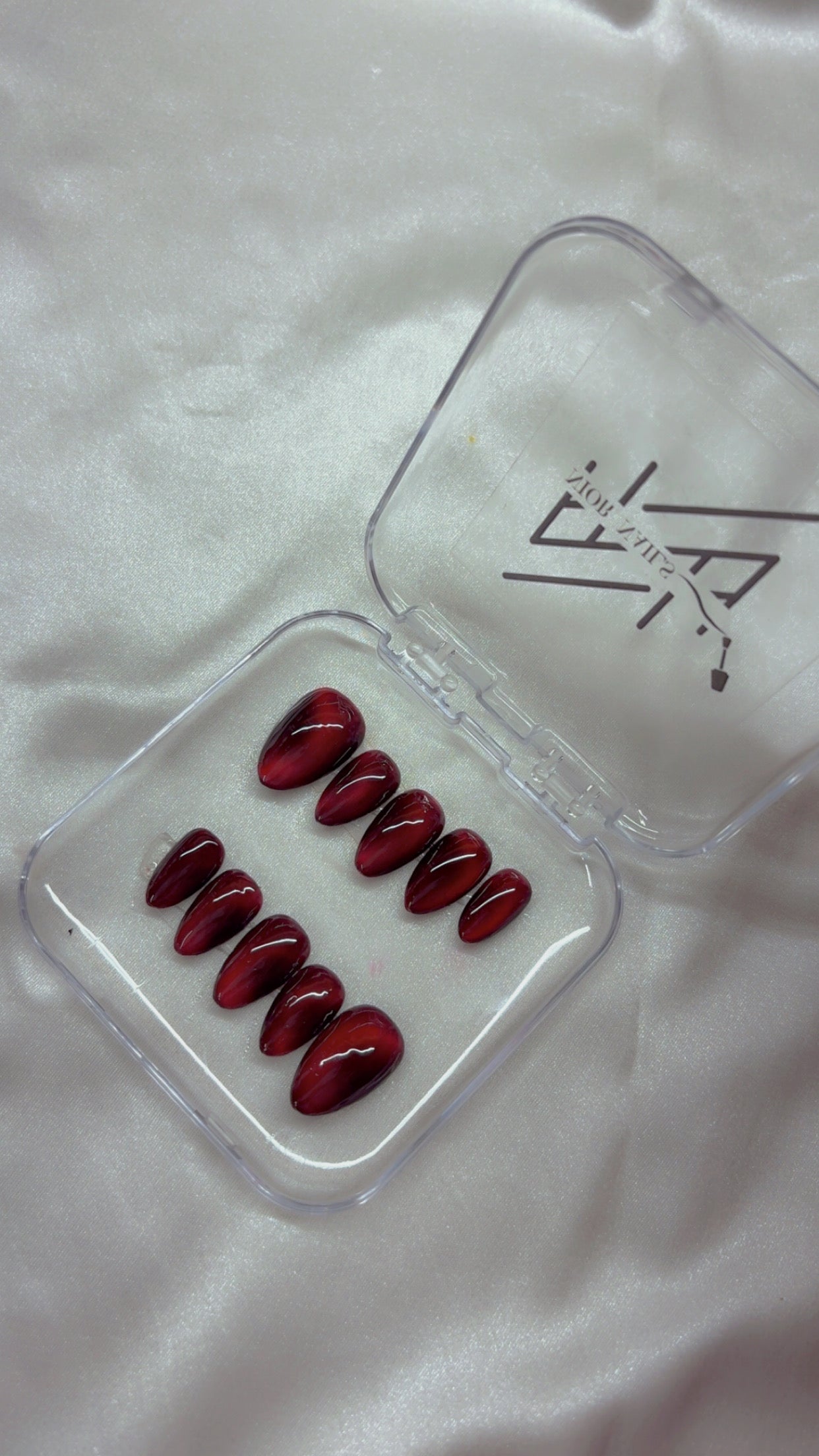 Red Cateye Swirl Nails